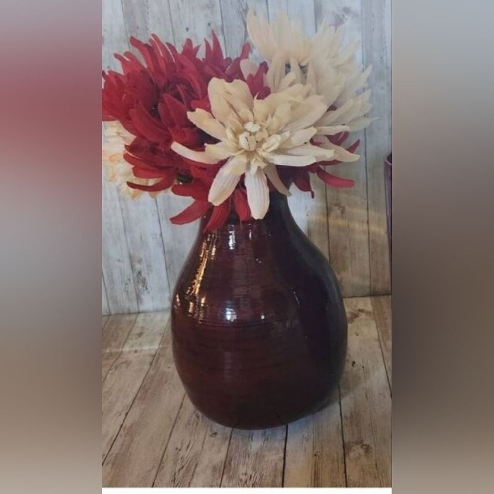 Large red decorative lacquerware vace and flowers